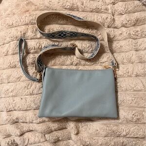 Elegant Blue Crossbody Bag with Patterned Strap
